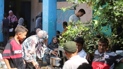 Palestinians, who fled their houses amid Israeli strikes, shelter at a United Nations-run school, (REUTERS)