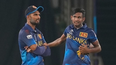 Sri Lanka's captain Dasun Shanaka, left, speaks to Matheesha Pathirana during the ICC Cricket World Cup match between Pakistan and Sri Lanka in Hyderabad (AP)