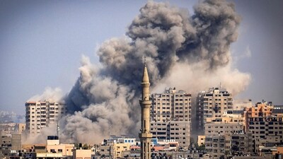 Smoke plumes billow during Israeli air strikes in Gaza City (AFP)