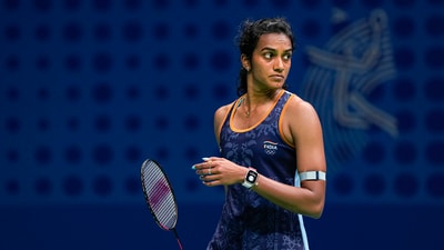 PV Sindhu reacts after losing the Women's Singles quarterfinal badminton match against China's He Bingjiao at the 19th Asian Games (PTI) PV Sindhu reacts after losing the Women's Singles quarterfinal badminton match against China's He Bingjiao at the 19th Asian Games (PTI)