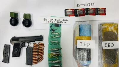 Punjab Police recovered two improvised explosive devices (IEDs), a timer switch, eight detonators, four batteries, two hand-grenades and a pistol along with its two magazines and 24 cartridges from the two accused. (HT Photo)