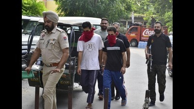 The two accused being produced in a court in Amritsar on Saturday. (Sameer Sehgal/HT)