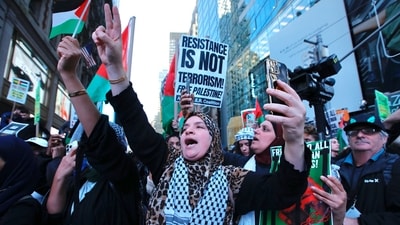 Supporters of Palestine protest in Times Square, New York on October 13, 2023. (AFP) Supporters of Palestine protest in Times Square, New York on October 13, 2023. (AFP)