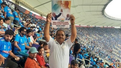 Israel thanks India as a fan waved a India stands with Israel poster during the India-Pakistan match on Saturday. Israel thanks India as a fan waved a India stands with Israel poster during the India-Pakistan match on Saturday.
