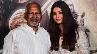 Mani Ratnam with Aishwarya Rai at a Ponniyin Selvan II promotional event. Mani Ratnam with Aishwarya Rai at a Ponniyin Selvan II promotional event.