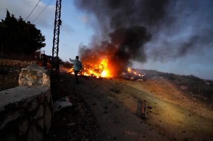 A journalist's car burns after it was hit by Israeli shelling in the Alma al-Shaab border village with Israel, south Lebanon, Friday, Oct. 13, 2023. (AP Photo/Hassan Ammar) (AP) A journalist's car burns after it was hit by Israeli shelling in the Alma al-Shaab border village with Israel, south Lebanon, Friday, Oct. 13, 2023. (AP Photo/Hassan Ammar) (AP)