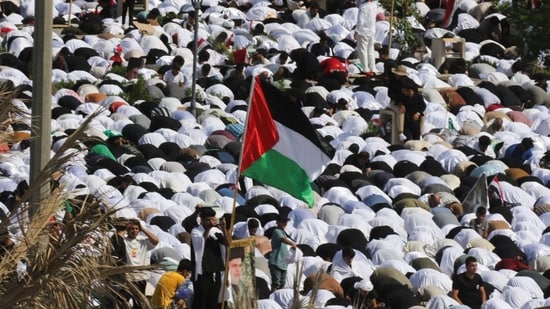 Supporters of Iraqi Shi'ite cleric Moqtada al-Sadr gather for mass Friday prayer during a protest in solidarity with Palestinians in Gaza, in Baghdad, Iraq.(Reuters)