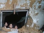 Palestinian children look at the building of the Zanon family, destroyed in Israeli airstrikes in Rafah, Gaza Strip, Palestinian children look at the building of the Zanon family, destroyed in Israeli airstrikes in Rafah, Gaza Strip,