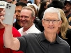 Apple CEO Tim Cook holds a new iPhone 15 Pro during the 'Wonderlust' event at the company's headquarters in Cupertino, California on September 12. 