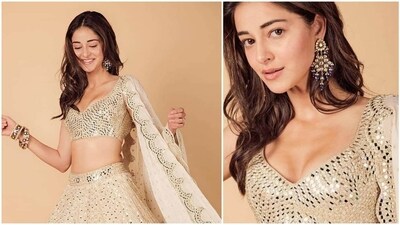 Ananya Panday's mirror work lehenga is a perfect inspiration for your Navratri party. Ananya's ivory lehenga shows that there's no such thing as too much mirror work. It featured a sexy blouse covered in mirrors and a dupatta. Mirror work always looks stunning and never goes out of fashion. An outfit like this is sure to steal the show. Add some chic earrings, bangles, minimal make-up and leave your hair down in the middle and you are ready to slay. (Instagram/@AananyaPandey) Ananya Panday's mirror work lehenga is a perfect inspiration for your Navratri party. Ananya's ivory lehenga shows that there's no such thing as too much mirror work. It featured a sexy blouse covered in mirrors and a dupatta. Mirror work always looks stunning and never goes out of fashion. An outfit like this is sure to steal the show. Add some chic earrings, bangles, minimal make-up and leave your hair down in the middle and you are ready to slay. (Instagram/@AananyaPandey)