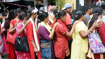 Visually impaired devotees wait in a queue to offer prayers at Durga Puja Mandal ahead of Durga Puja festival in Kolkata. (ANI) Visually impaired devotees wait in a queue to offer prayers at Durga Puja Mandal ahead of Durga Puja festival in Kolkata. (ANI)