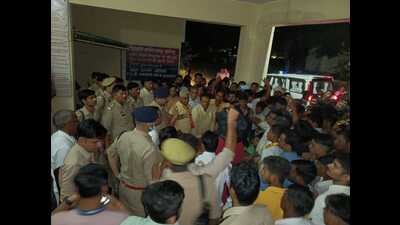An angry mob gathers outside the police station in Chandaus, Aligarh district, following the clash during the Ram Barat procession. (Sourced) An angry mob gathers outside the police station in Chandaus, Aligarh district, following the clash during the Ram Barat procession. (Sourced)