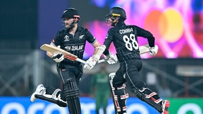 New Zealand's captain Kane Williamson (L) and Devon Conway run between the wickets during the 2023 ICC Men's Cricket World Cup one-day international (ODI) match between New Zealand and Bangladesh (AFP) New Zealand's captain Kane Williamson (L) and Devon Conway run between the wickets during the 2023 ICC Men's Cricket World Cup one-day international (ODI) match between New Zealand and Bangladesh (AFP)