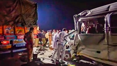 Police personnel at the spot after a speeding mini-bus hit a container on Samruddhi Expressway, in Chhatrapati Sambhajinagar district, early Sunday morning. (PTI) Police personnel at the spot after a speeding mini-bus hit a container on Samruddhi Expressway, in Chhatrapati Sambhajinagar district, early Sunday morning. (PTI)
