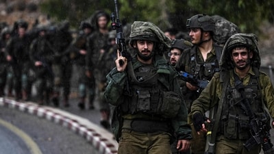 Israel-Hamas War: Israeli army soldiers patrol an undisclosed area in northern Israel bordering Lebanon. (AFP) Israel-Hamas War: Israeli army soldiers patrol an undisclosed area in northern Israel bordering Lebanon. (AFP)