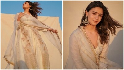 It is not possible to talk about fashion and style and not mention the queen of B-town, Alia Bhatt. Her gorgeous anarkali look is sure to steal your heart. Featuring a V-neckline, full sleeves, a tie-up at the midriff and a mesmerising gold floral embroidery paired with an organza duppata, it is the perfect showstopper look. Accessorise it with a pair of traditional jhumkas, a small red bindi, minimal make-up and open hair for the perfect Alia Bhatt-inspired Navratri look. (Instagram/@AliaBhatt) It is not possible to talk about fashion and style and not mention the queen of B-town, Alia Bhatt. Her gorgeous anarkali look is sure to steal your heart. Featuring a V-neckline, full sleeves, a tie-up at the midriff and a mesmerising gold floral embroidery paired with an organza duppata, it is the perfect showstopper look. Accessorise it with a pair of traditional jhumkas, a small red bindi, minimal make-up and open hair for the perfect Alia Bhatt-inspired Navratri look. (Instagram/@AliaBhatt)