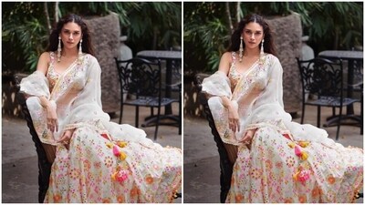 Lehengas are definitely the festive favourite. And Aditi Rao Hydari is here to show you how to rock the lehenga look this Navratri. Her elegant white sleeveless blouse is embellished with mirror work and embroidery details in multi-coloured shades. Paired with a matching long and flowing skirt and an organza dupatta embellished with mirrors and embroidery, she gives the perfect style inspiration to stun on day 2 of Shardiya Navratri. (Instagram/@aditiraohydari) Lehengas are definitely the festive favourite. And Aditi Rao Hydari is here to show you how to rock the lehenga look this Navratri. Her elegant white sleeveless blouse is embellished with mirror work and embroidery details in multi-coloured shades. Paired with a matching long and flowing skirt and an organza dupatta embellished with mirrors and embroidery, she gives the perfect style inspiration to stun on day 2 of Shardiya Navratri. (Instagram/@aditiraohydari)