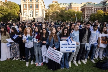 Pro-Israel demonstrators sing a song during a protest at Columbia University on October 12. (AP) Pro-Israel demonstrators sing a song during a protest at Columbia University on October 12. (AP)