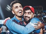 Afghanistan's Mujeeb Ur Rahman and Rashid Khan celebrate the team's victory against England in the ICC Cricket World Cup 2023, at Arun Jaitley Stadium in New Delhi on Sunday
Afghanistan's Mujeeb Ur Rahman and Rashid Khan celebrate the team's victory against England in the ICC Cricket World Cup 2023, at Arun Jaitley Stadium in New Delhi on Sunday