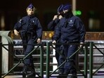 Belgian police officers walk as they secure the area after a shooting in Brussels, Belgium, October 16, 2023.
