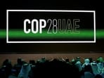 FILE PHOTO: 'Cop28 UAE' logo is displayed on the screen during the opening ceremony of Abu Dhabi Sustainability Week (ADSW) under the theme of 'United on Climate Action Toward COP28', in Abu Dhabi, UAE, January 16, 2023. REUTERS/Rula Rouhana/File Photo