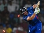 England's captain Jos Buttler is clean bowled during the 2023 ICC Men's Cricket World Cup one-day international (ODI) match between England and Afghanistan 