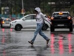 A girl crosses a street during a heavy rain in Jammu, India, Monday, Oct.16, 2023. (AP Photo/Channi Anand) A girl crosses a street during a heavy rain in Jammu, India, Monday, Oct.16, 2023. (AP Photo/Channi Anand)