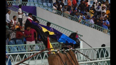 A banner fell on the spectators following thunderstorm in Lucknow on Monday. (HT)