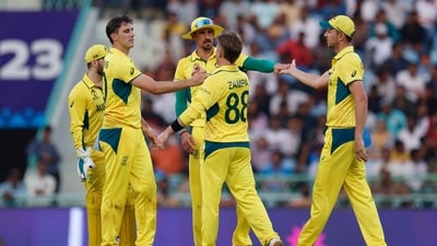 Australia's Pat Cummins celebrates with Mitchell Starc and Adam Zampa after taking the wicket of South Africa's Aiden Markram (REUTERS)