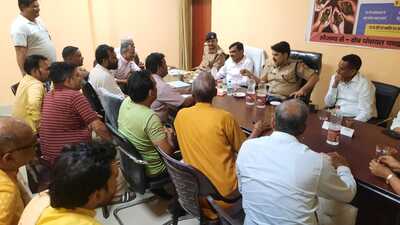 District Magistrate Aligarh Indra Vikram Singh and SSP Aligarh Kalanidhi Naithani interacting with locals at Chandaus town on Monday. (HT photo) District Magistrate Aligarh Indra Vikram Singh and SSP Aligarh Kalanidhi Naithani interacting with locals at Chandaus town on Monday. (HT photo)