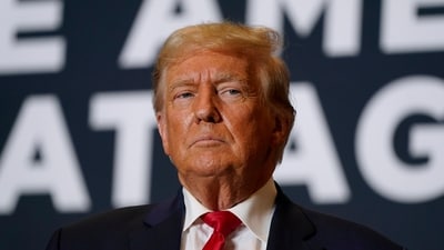 Former President Donald Trump arrives at a rally in Cedar Rapids, Iowa. (AP) Former President Donald Trump arrives at a rally in Cedar Rapids, Iowa. (AP)