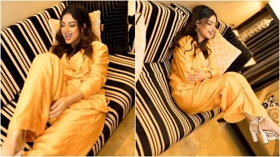 Harnaaz's bright yellow outfit features a blazer, pants and a matching top. The silk-satin co-ord ensemble mixes feminine grace with boss babe aesthetics. It is a perfect sartorial pick for attending work meetings, going out on brunch dates with your girlfriends, or attending dinner outings with your partner. Read our download on the outfit below. (Instagram) Harnaaz's bright yellow outfit features a blazer, pants and a matching top. The silk-satin co-ord ensemble mixes feminine grace with boss babe aesthetics. It is a perfect sartorial pick for attending work meetings, going out on brunch dates with your girlfriends, or attending dinner outings with your partner. Read our download on the outfit below. (Instagram)