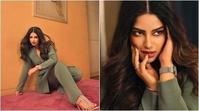Harnaaz wore a striking green pantsuit for the occasion. While the blazer features notch lapels, full-length sleeves, padded shoulders, and a stylish belt cinching the waist, the pants have a high-rise waistline and straight-leg fit. She wore it with stilettos, bracelets, a watch, a choker necklace, matching earrings, rings, smoky eyes, berry-toned lips, centre-parted open wavy tresses, and feathered brows. (Instagram) Harnaaz wore a striking green pantsuit for the occasion. While the blazer features notch lapels, full-length sleeves, padded shoulders, and a stylish belt cinching the waist, the pants have a high-rise waistline and straight-leg fit. She wore it with stilettos, bracelets, a watch, a choker necklace, matching earrings, rings, smoky eyes, berry-toned lips, centre-parted open wavy tresses, and feathered brows. (Instagram)