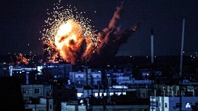A ball of fire and smoke rise above buildings during an Israeli strike on Rafah in the southern Gaza Strip on October 15. (AFP) A ball of fire and smoke rise above buildings during an Israeli strike on Rafah in the southern Gaza Strip on October 15. (AFP)