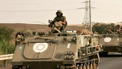 Israel-Hamas War: Israeli soliders ride in their armoured vehicles towards the border with the Gaza Strip. (AFP) Israel-Hamas War: Israeli soliders ride in their armoured vehicles towards the border with the Gaza Strip. (AFP)