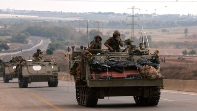 Israel-Hamas War: Israeli soldiers ride in their armoured vehicles towards the border with the Gaza Strip. (AFP)