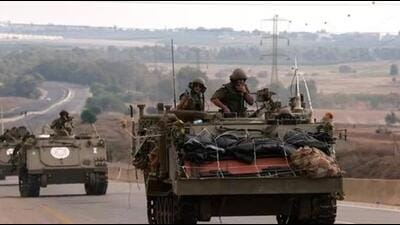 Israel-Hamas War: Israeli soldiers ride in their armoured vehicles towards the border with the Gaza Strip. (AFP) Israel-Hamas War: Israeli soldiers ride in their armoured vehicles towards the border with the Gaza Strip. (AFP)