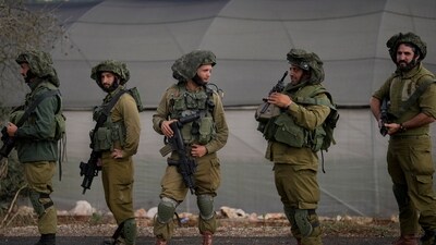 Israel-Hamas War: Israeli soldiers patrol along a road near the border between Israel and Lebanon, in Israel. (AP) Israel-Hamas War: Israeli soldiers patrol along a road near the border between Israel and Lebanon, in Israel. (AP)