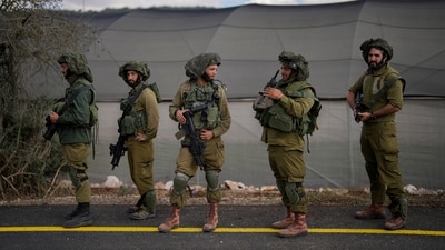 Israeli soldiers patrol along a road near the border between Israel and Lebanon, in Israel, Monday, Oct. 16, 2023. (AP) Israeli soldiers patrol along a road near the border between Israel and Lebanon, in Israel, Monday, Oct. 16, 2023. (AP)