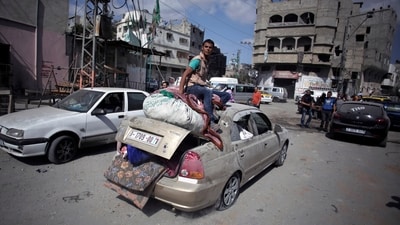 Palestinians salvage what little of their belongings they could from their homes during a 12-hour cease-fire in Gaza City (AP) Palestinians salvage what little of their belongings they could from their homes during a 12-hour cease-fire in Gaza City (AP)