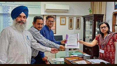 Members of Punjab Government School Teachers’ Union presenting their demand letter to DC Surabhi Malik in Ludhiana. (HT PHOTO)
