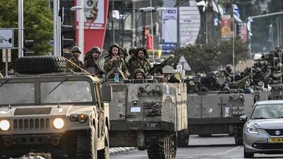Israel-Hamas War: Israeli soldiers patrol in armoured personnel carriers at an undisclosed position in northern Israel near the border with Lebanon. (AFP) Israel-Hamas War: Israeli soldiers patrol in armoured personnel carriers at an undisclosed position in northern Israel near the border with Lebanon. (AFP)