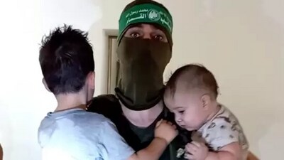 A Hamas terrorists with toddlers as hostages in Gaza.