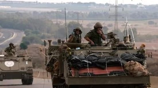 Israel-Hamas War: Israeli soldiers ride in their armoured vehicles towards the border with the Gaza Strip. (AFP)