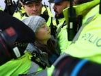 Swedish climate activist Greta Thunberg is arrested by police outside the InterContinental London Park Lane.