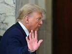 (FILES) Former US President Donald Trump waves after speaking to the media during the third day of his civil fraud trial in New York on October 4, 2023. (Photo by ANGELA WEISS / AFP) (FILES) Former US President Donald Trump waves after speaking to the media during the third day of his civil fraud trial in New York on October 4, 2023. (Photo by ANGELA WEISS / AFP)