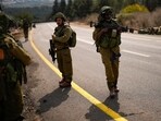 Israeli soldiers patrol a road near the border between Israel and Lebanon on October 16. Israeli soldiers patrol a road near the border between Israel and Lebanon on October 16.