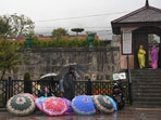 A street vendor sells umbrellas in Srinagar on October 16.
