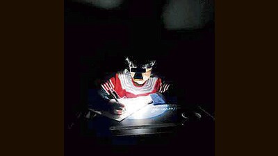 A students studies under battery-powered light. (Facebook) A students studies under battery-powered light. (Facebook)