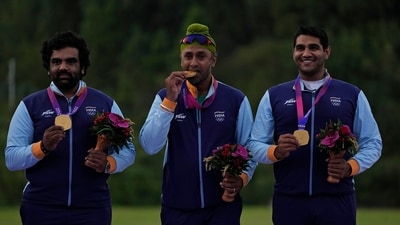 From left, India's Prithviraj Tondaiman, Zoravar Singh Sandhu and Kynan Darius Chenai celebrate with their gold medals during the awards ceremony for the Shooting Trap Team Men competitions of the 19th Asian Games in Hangzhou (AP) From left, India's Prithviraj Tondaiman, Zoravar Singh Sandhu and Kynan Darius Chenai celebrate with their gold medals during the awards ceremony for the Shooting Trap Team Men competitions of the 19th Asian Games in Hangzhou (AP)